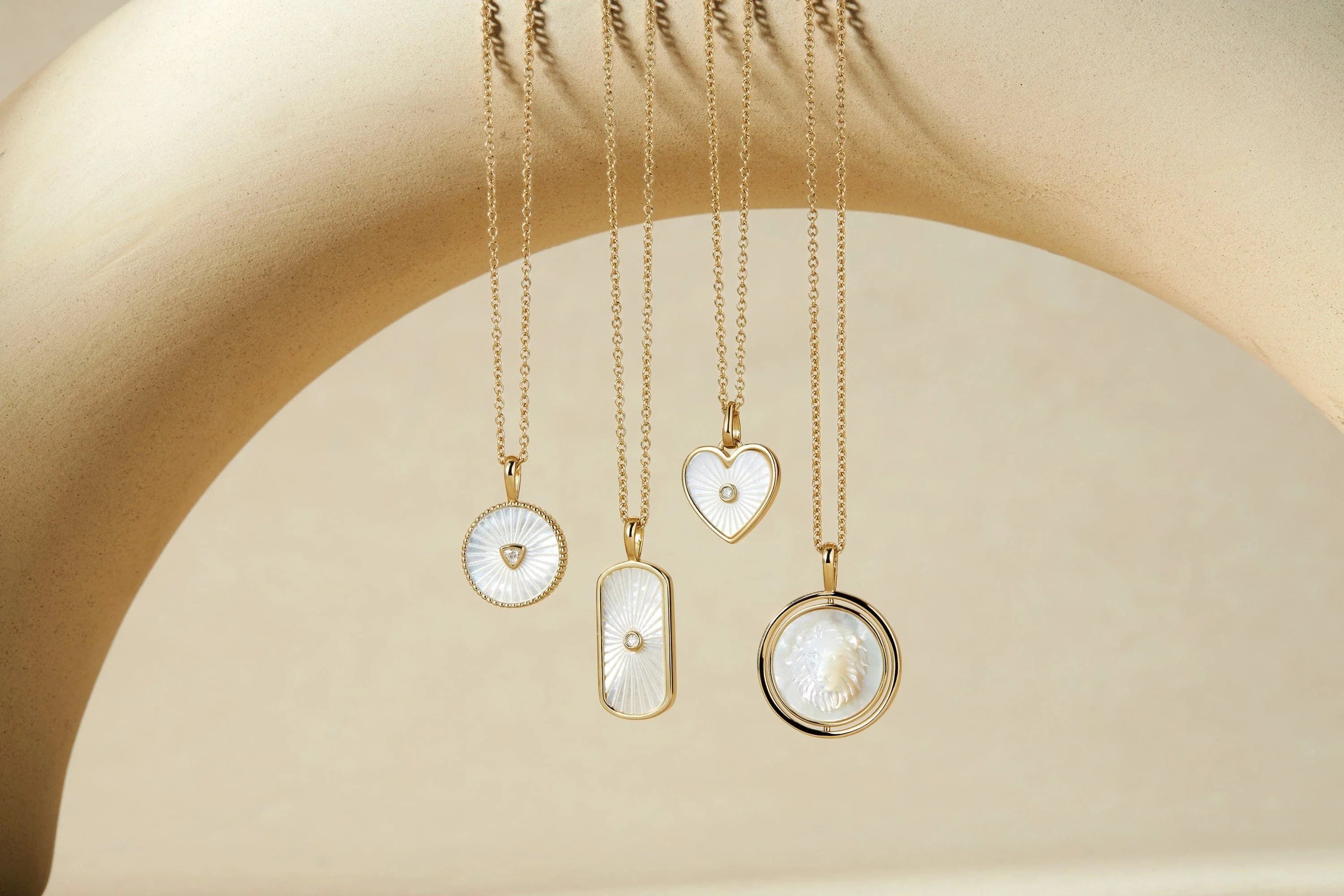 Gold necklaces with beautiful mother of pearl lion pendants good for everyday style