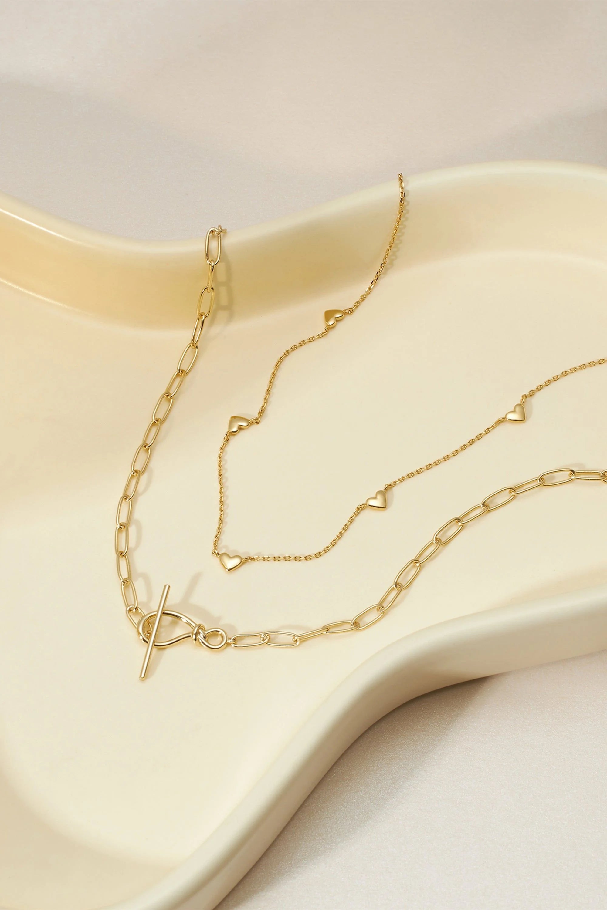 Gold layered necklaces from the Multi Micro Heart Necklace collection showcase cute heart designs