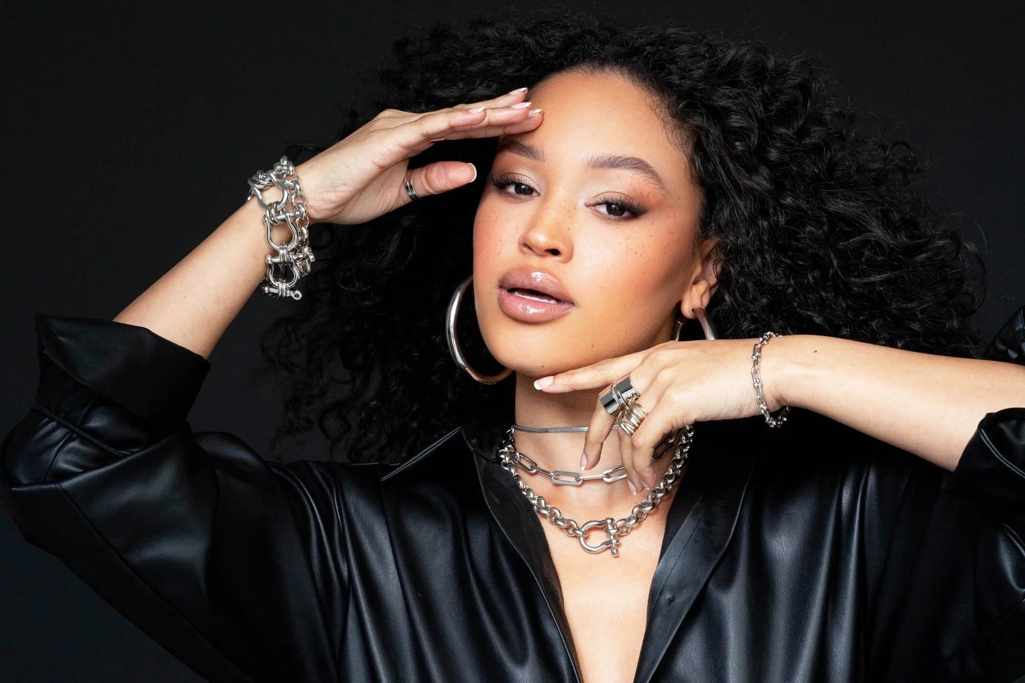 Woman wearing stunning silver jewelry from the Royal Necklace collection