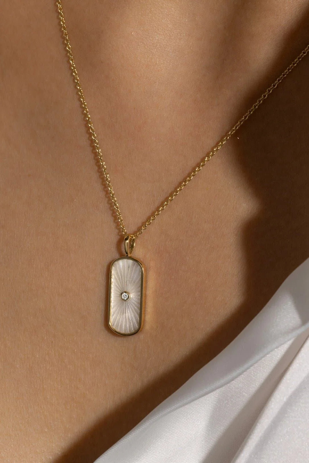 Gold necklace with white Tag Shaped Mop pendant and sparkling CZ stone for elegant look