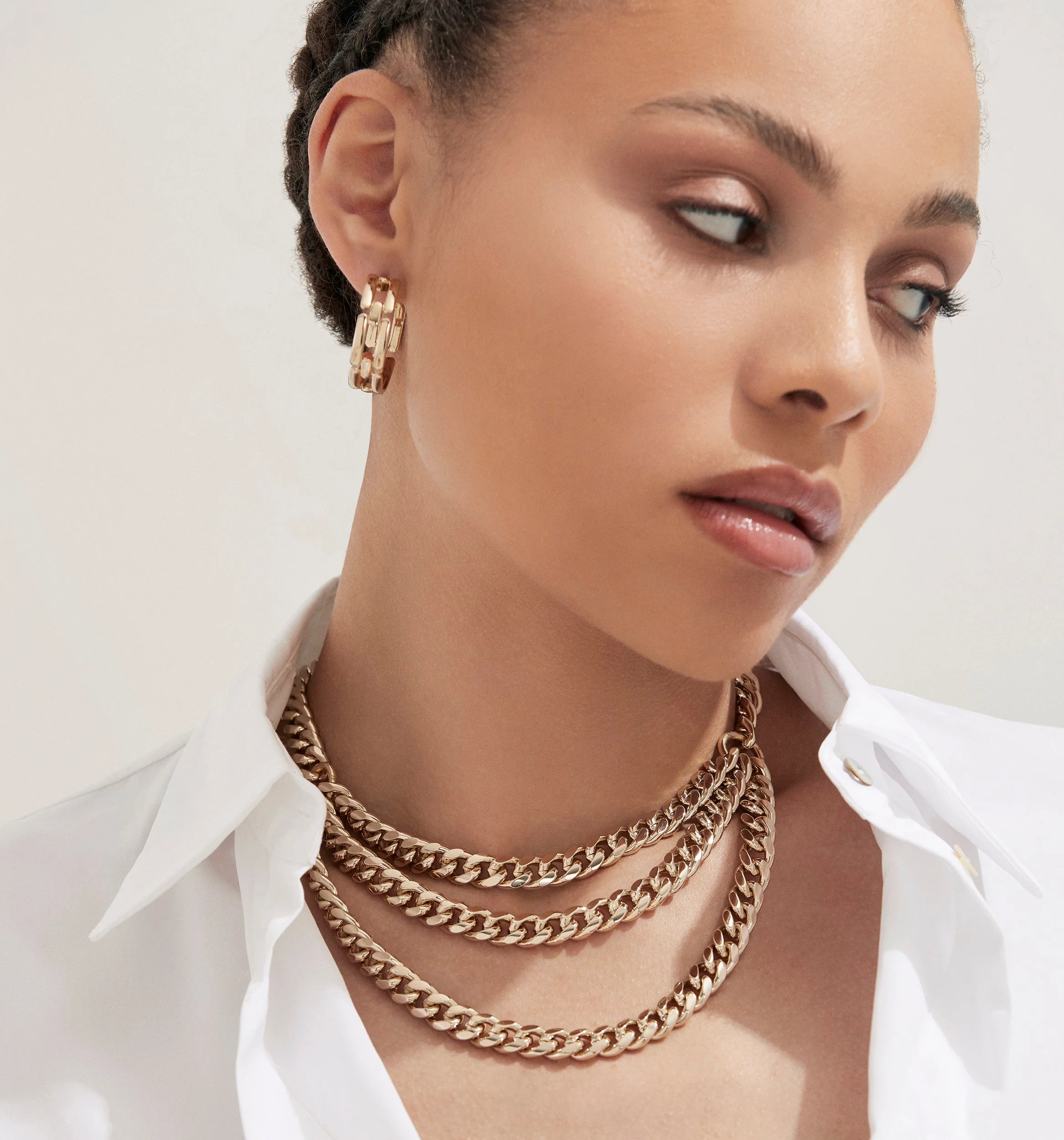 Gold chain necklaces from the Triple Layer Curb Chain Necklace collection