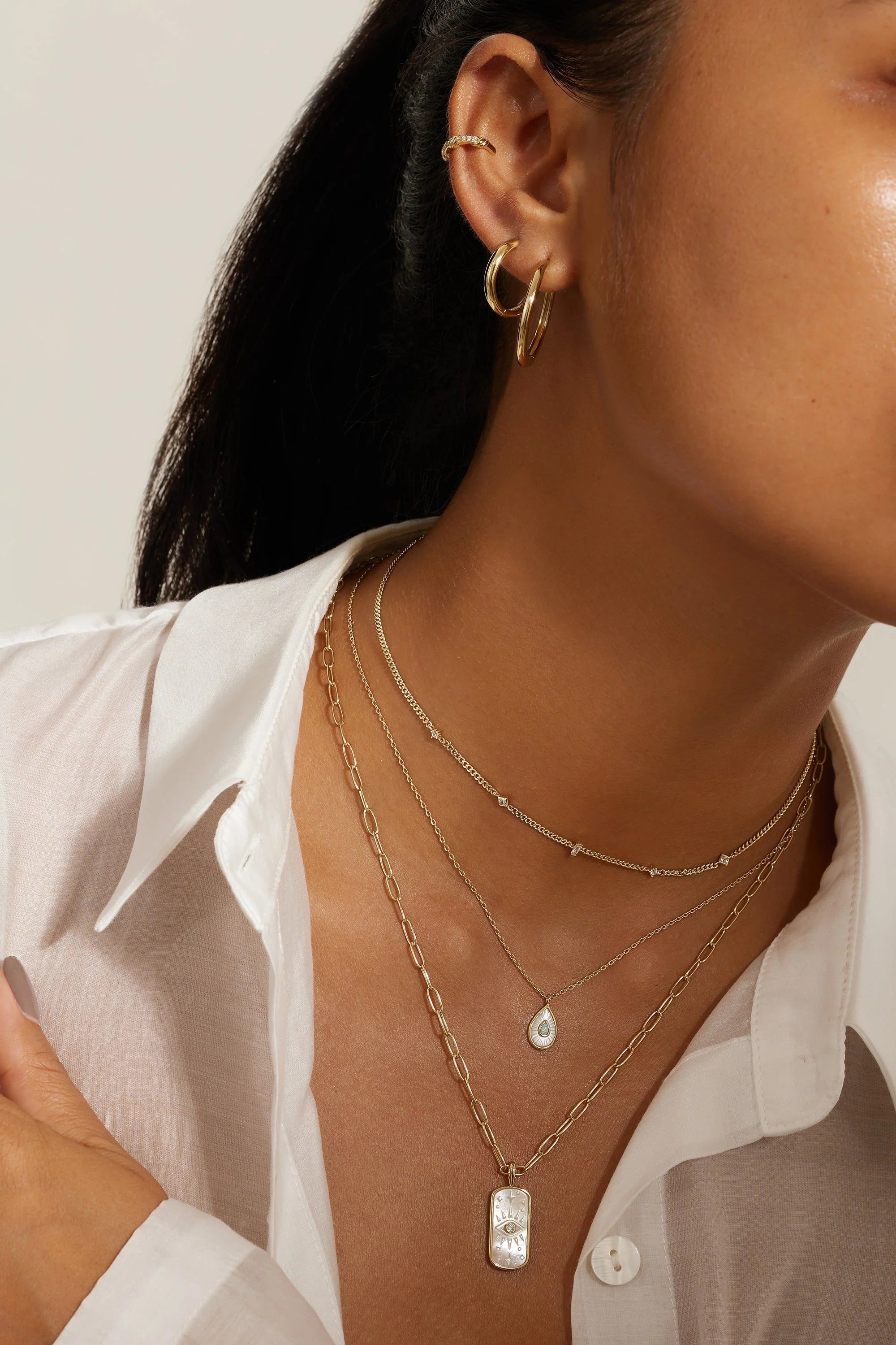 Layered gold necklaces and hoop earrings with Pear Shaped Mop Pendant and Opal Necklace