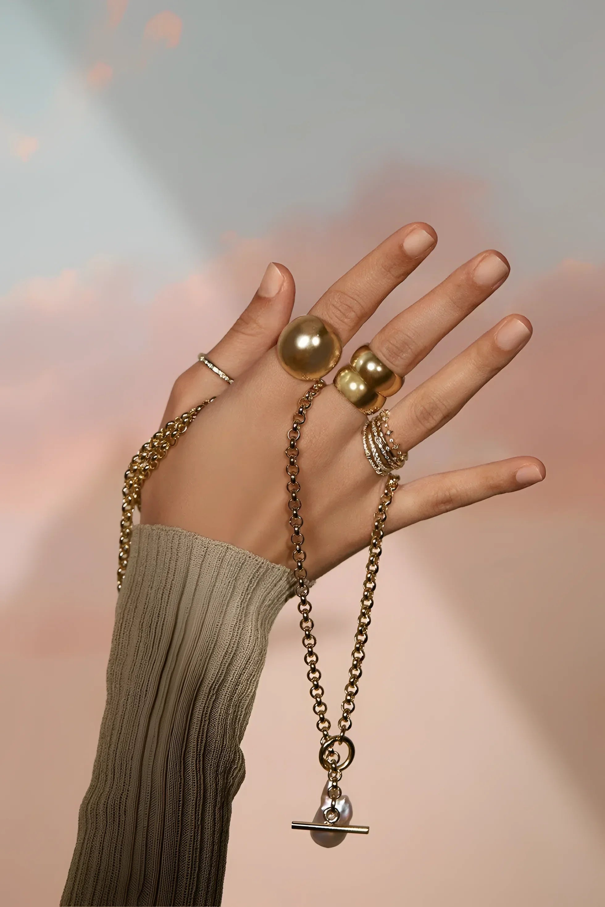 Hand with gold jewelry showcasing CZ Studded Thin Ring for stylish look