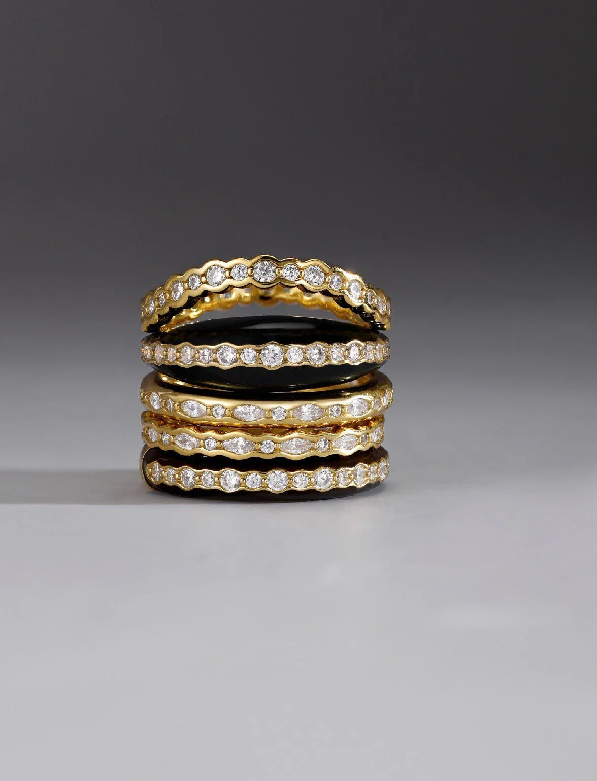 Stacked gold and diamond eternity rings for the Thin Black Enamel & CZ Channel Ring product