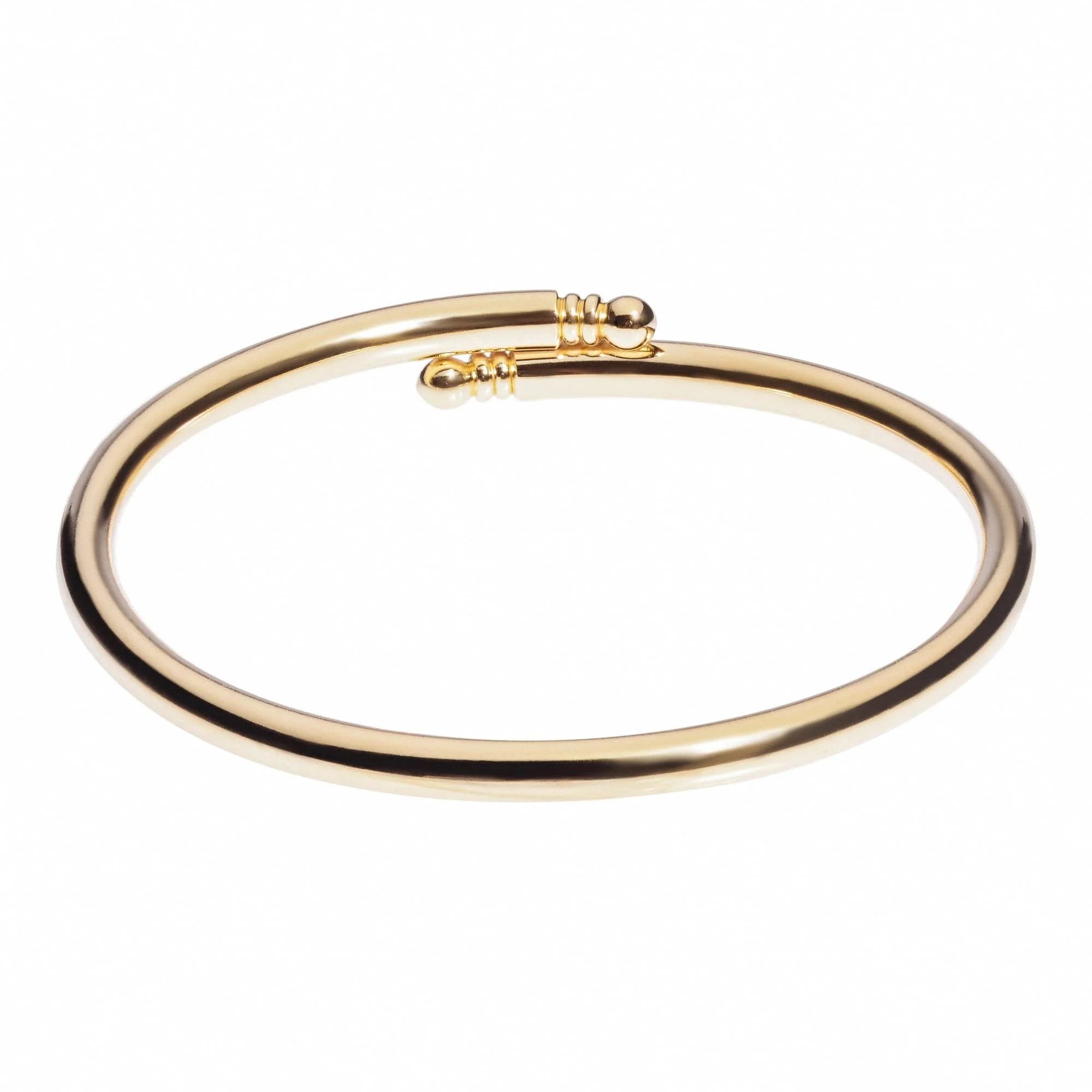 Gold-colored open-ended brass bangle shown in Knob Ended Bangle product image
