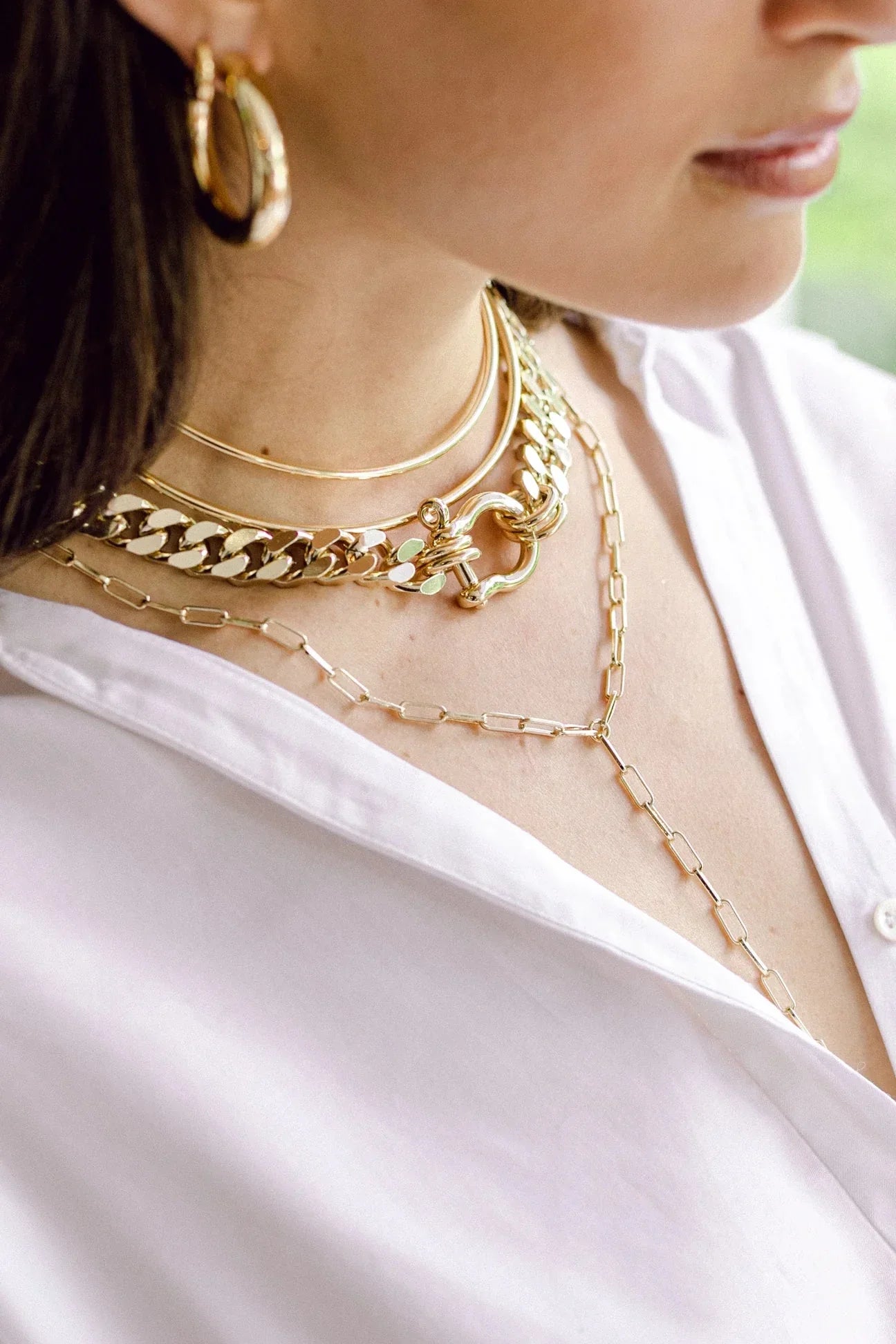 Gold layered necklaces featuring an Elongated Link Lariat in recycled brass plated design