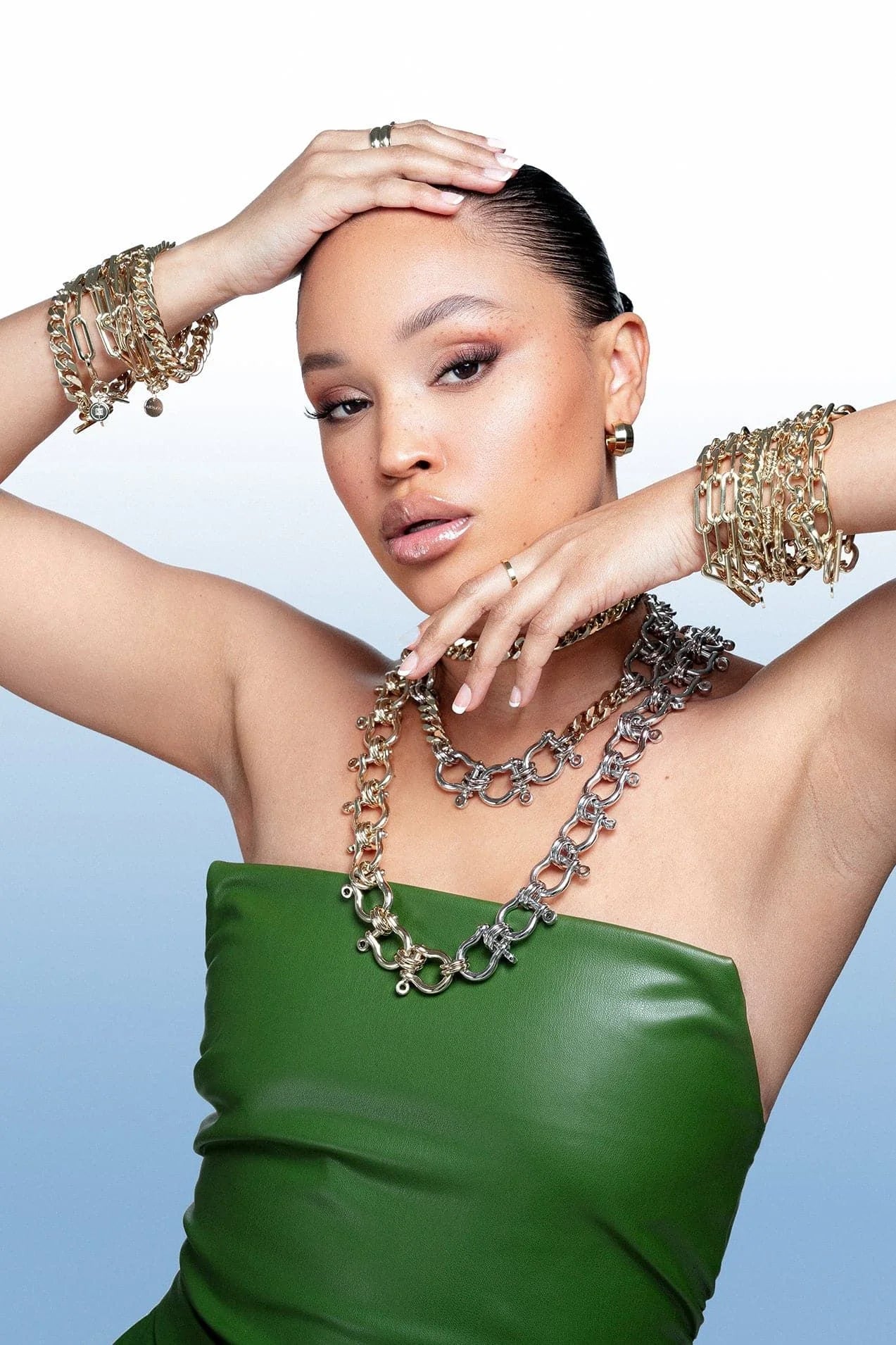 Woman wearing Enzo Toggle Chain Bracelet with twisted link design and alternating links