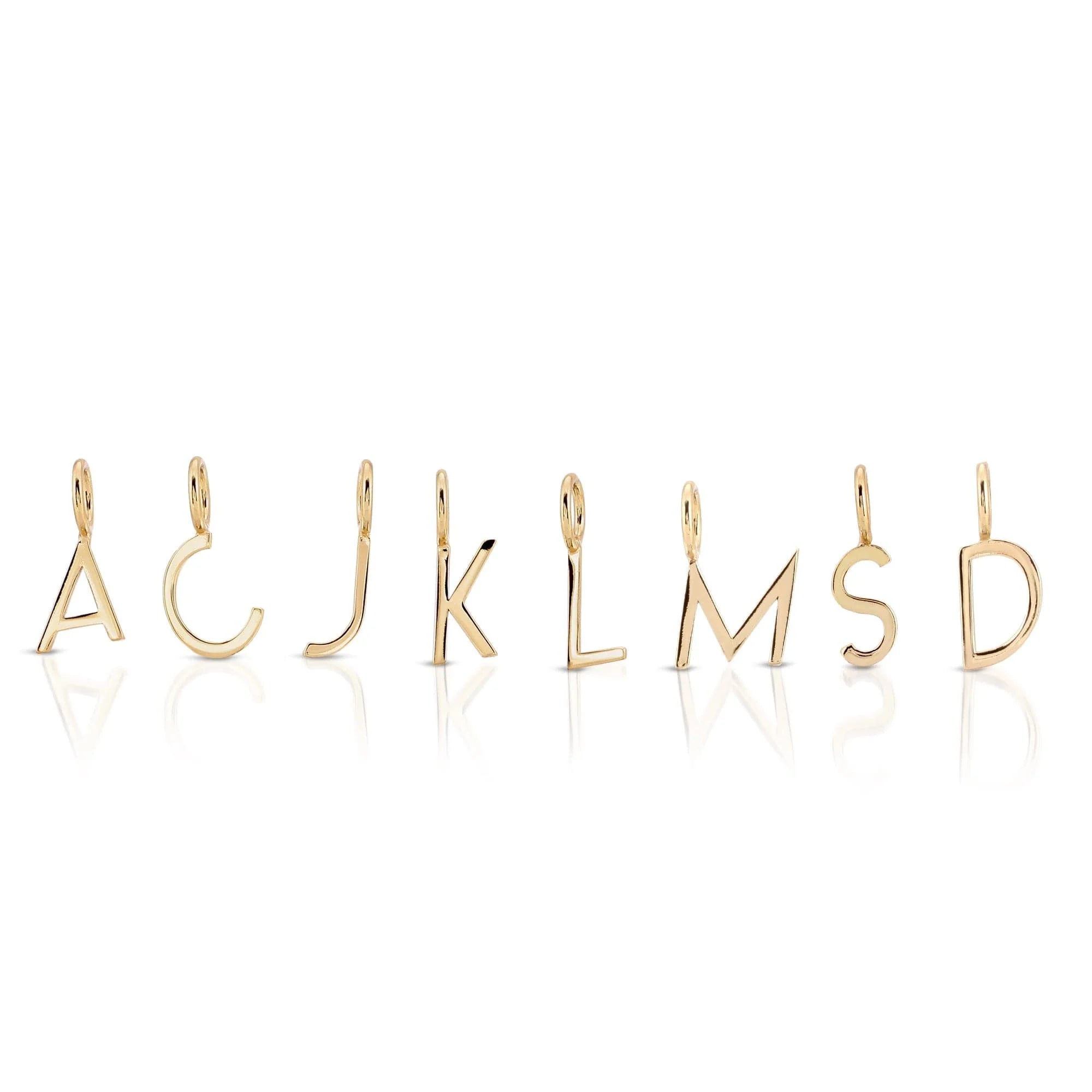 Gold letter pendants from Essential Letters featuring recycled brass plated charms and 15mm letters