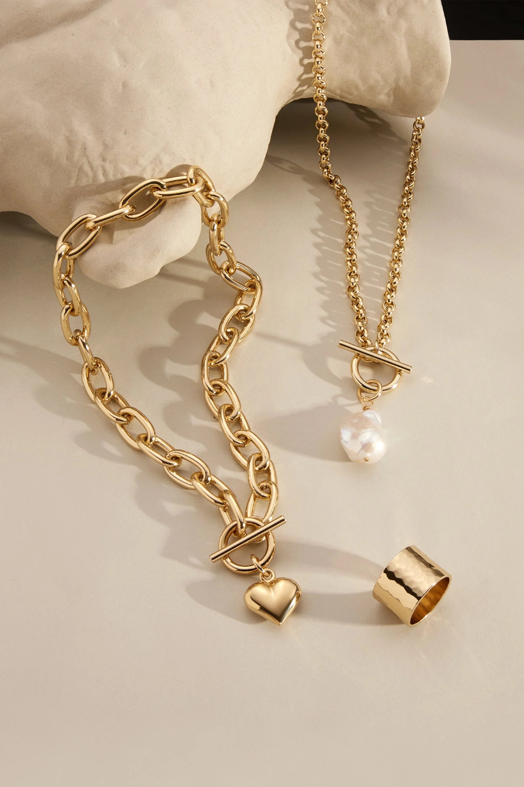 Gold-toned jewelry set featuring a hammered wide ring for elegant style
