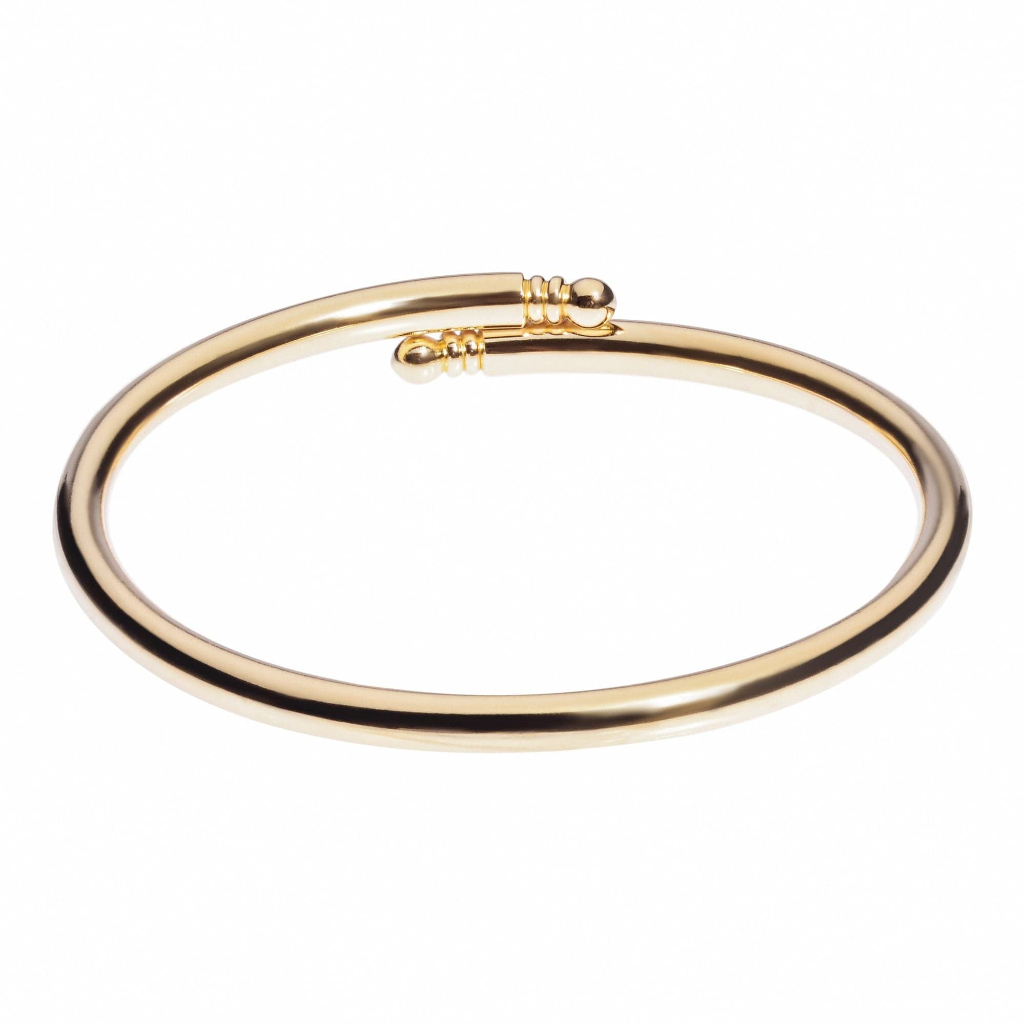 Gold-colored brass bangle with open-ended design, named Knob Ended Bangle