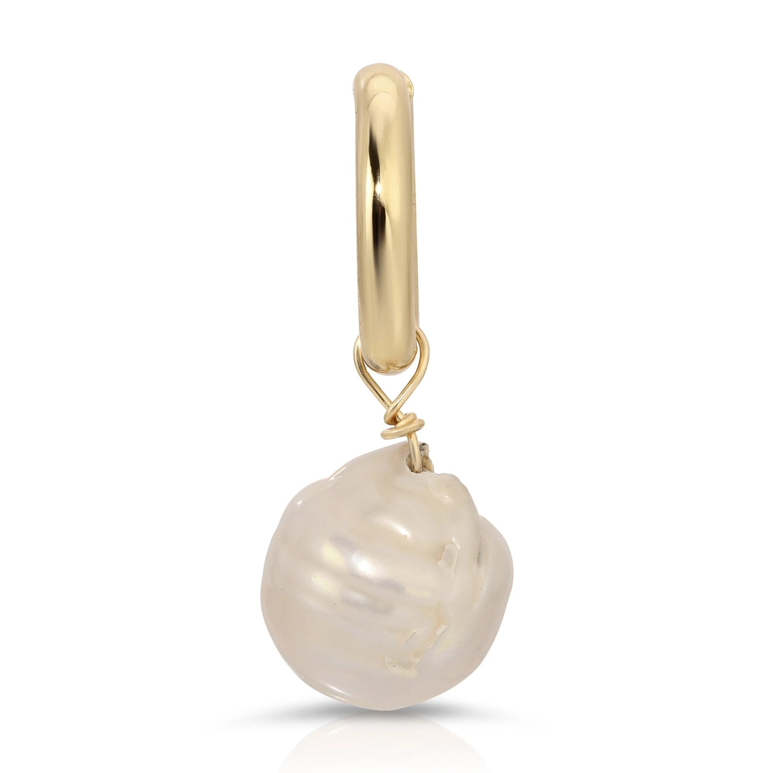 Gold hoop earring with large baroque pearl pendant featuring recycled brass ring design