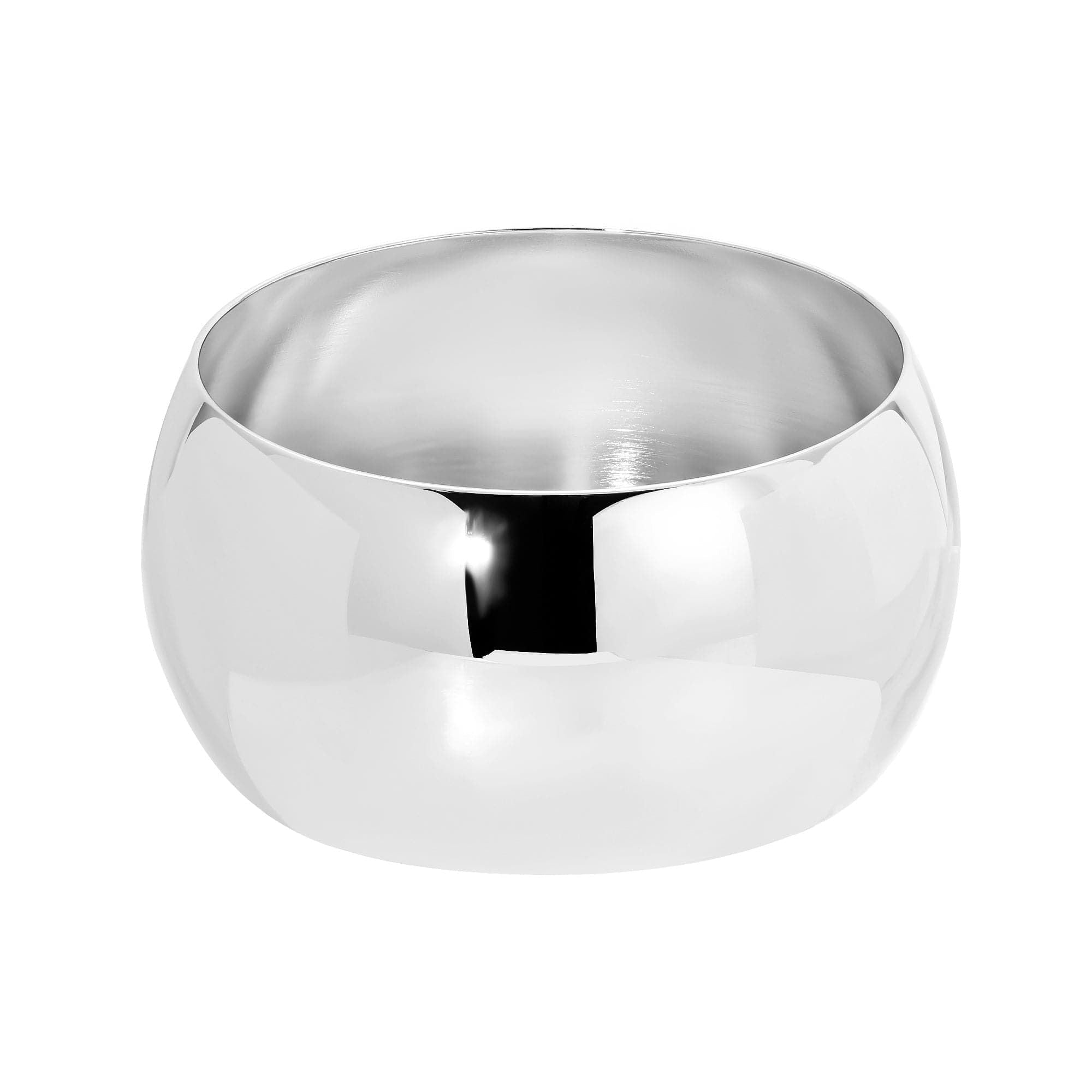 Shiny silver bowl accentuating the Large Domed Bangle made from recycled brass