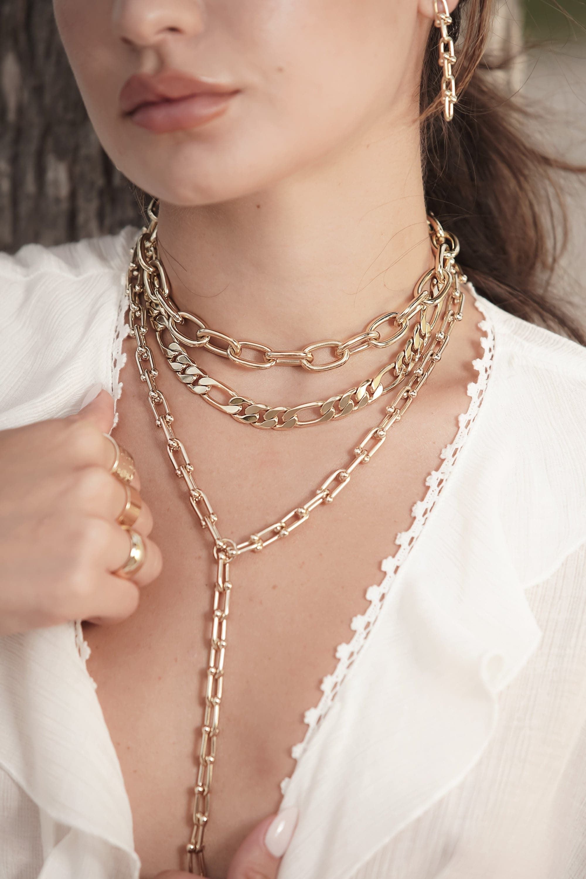 Gold chain jewelry set featuring the Margaux Lariat Necklace with custom U link options