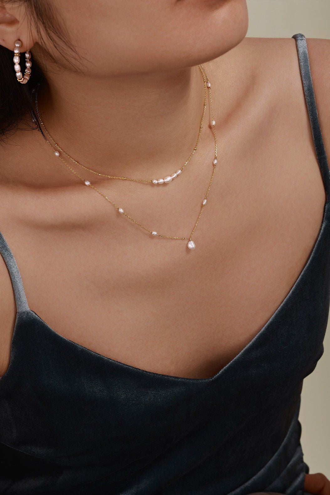 Woman showcasing a Micro Clustered Pearl & Bead Necklace with 14k gold vermeil accents