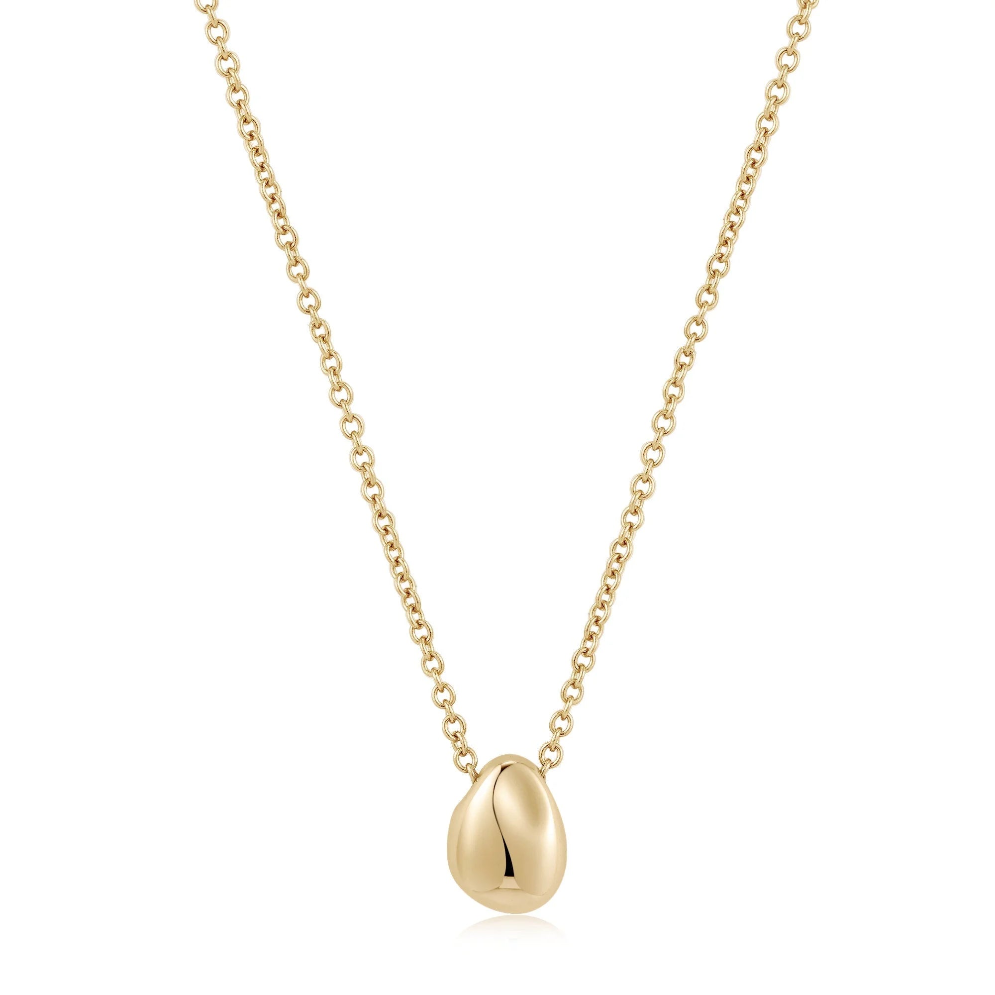 Gold pendant necklace featuring the Micro Harmony Pebble Pendant Necklace design