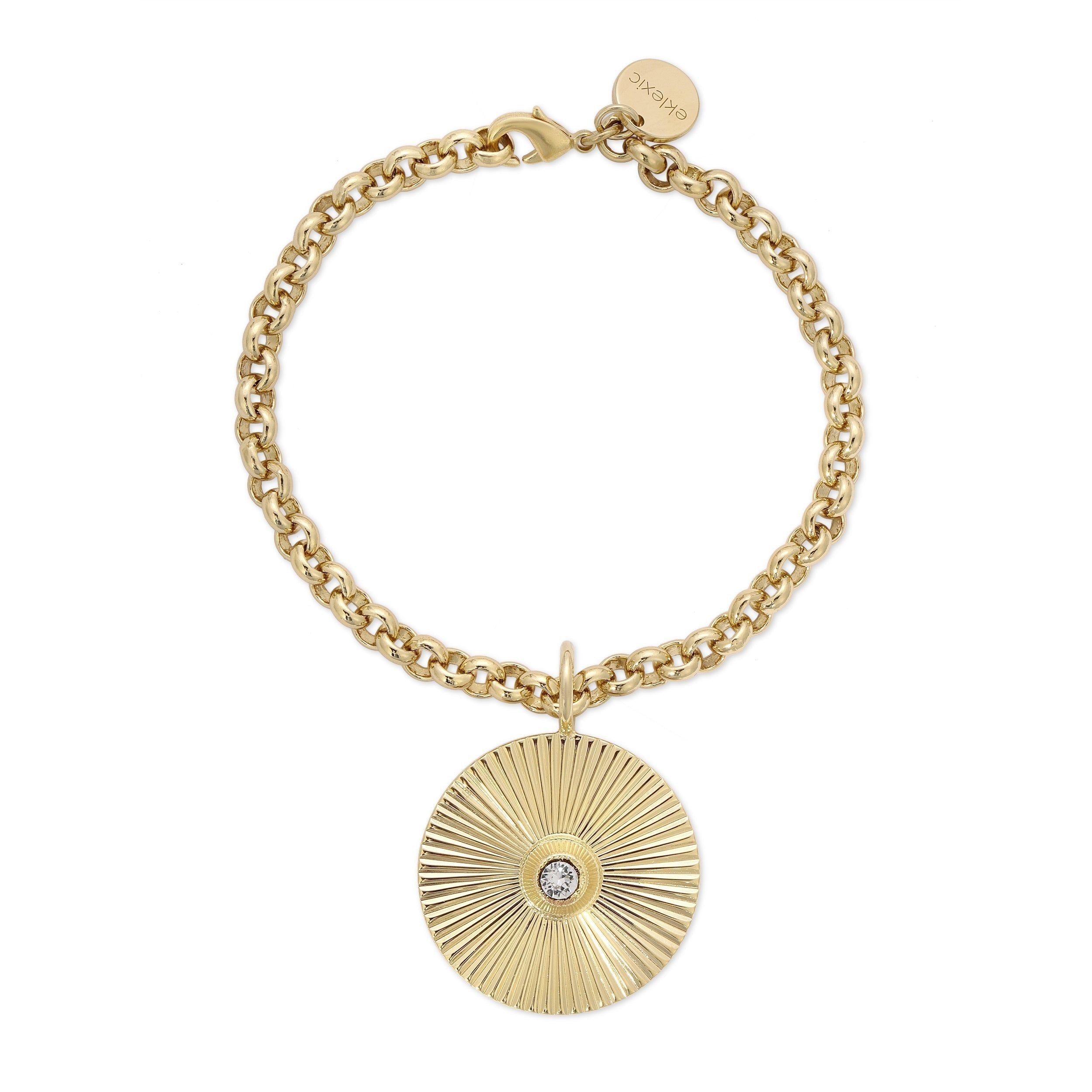 Gold chain bracelet with sunburst pendant featuring 14k gold plating and fresh water pearl