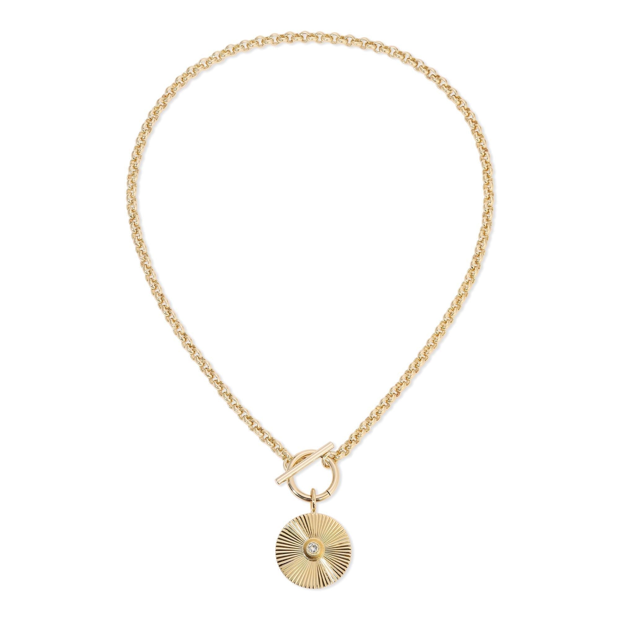 Gold chain necklace with ocean pendant featuring rolo chain links and rhodium plating