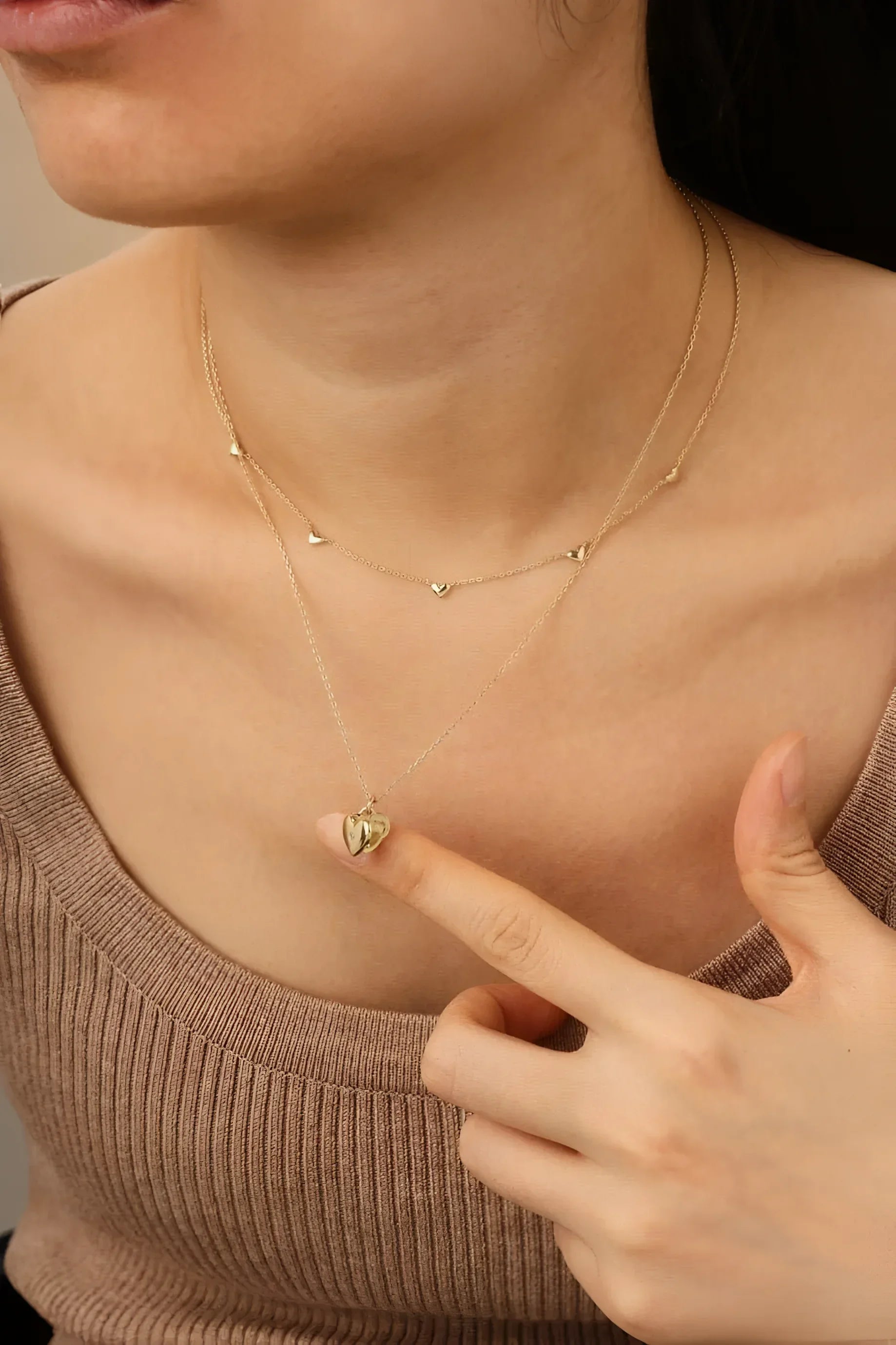 Gold layered necklaces from the Multi Micro Heart Necklace collection
