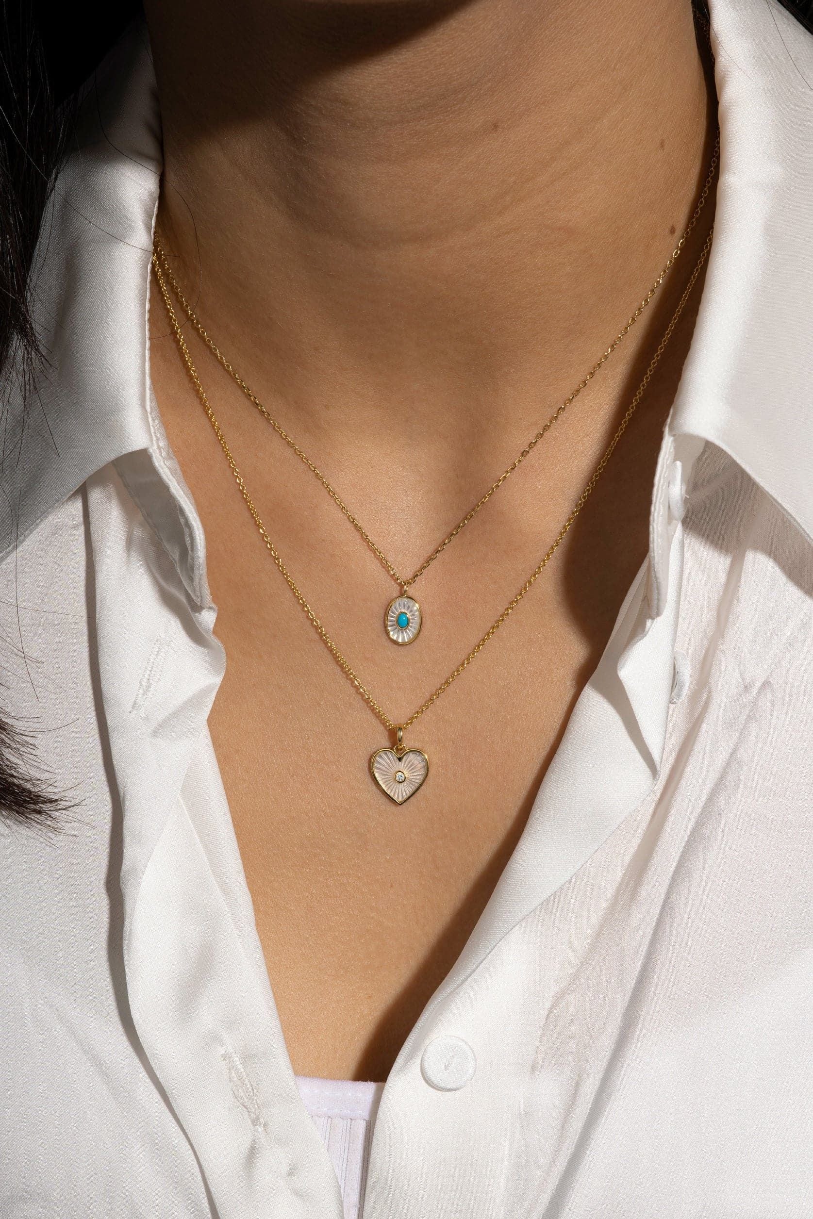 Two 14k gold necklaces featuring Oval Shaped Mop Pendants with Turquoise Stone