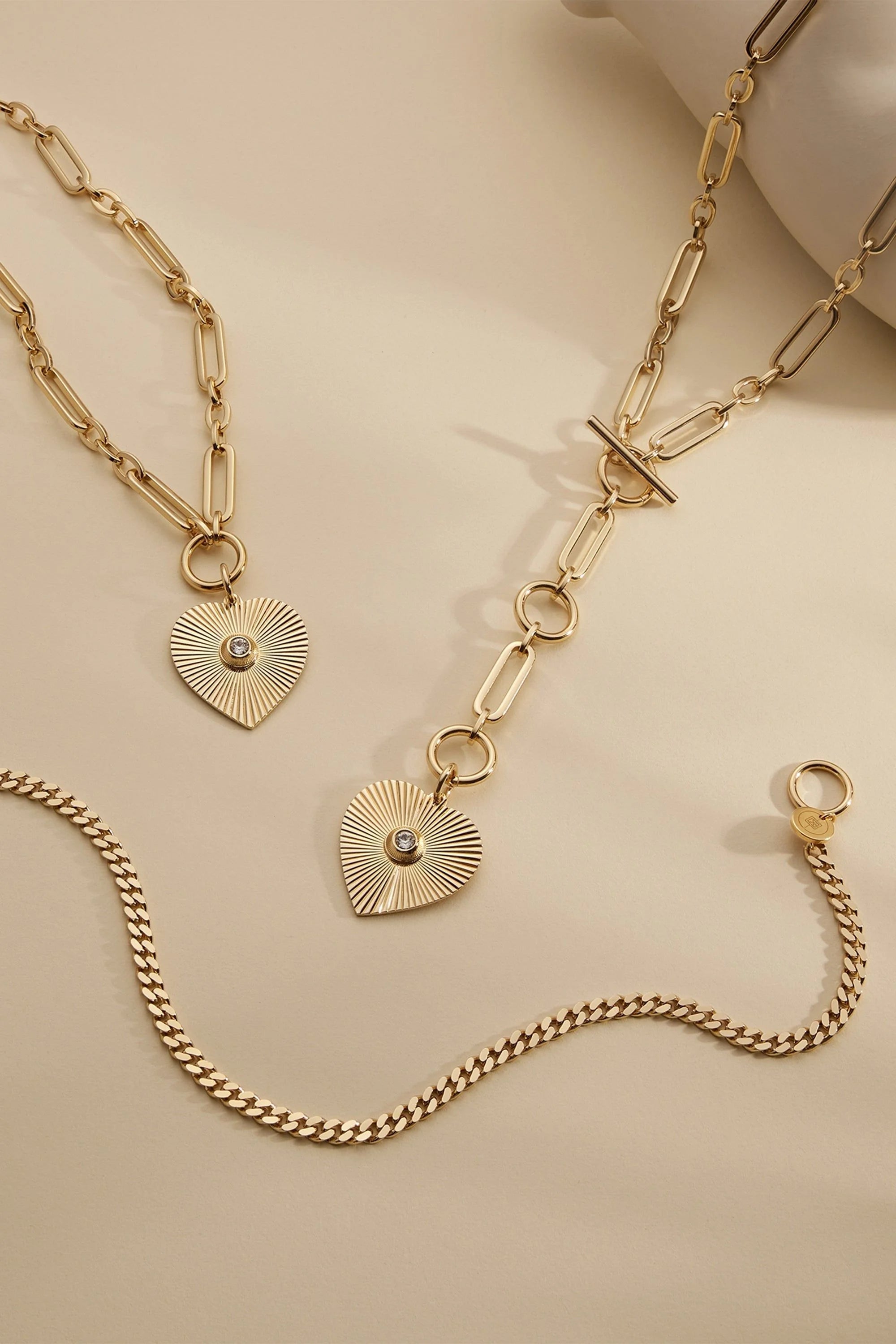 Gold-toned jewelry set with heart pendants in 14k gold plated recycled brass and Swarovski crystal