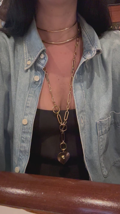 a close up of a person wearing a necklace