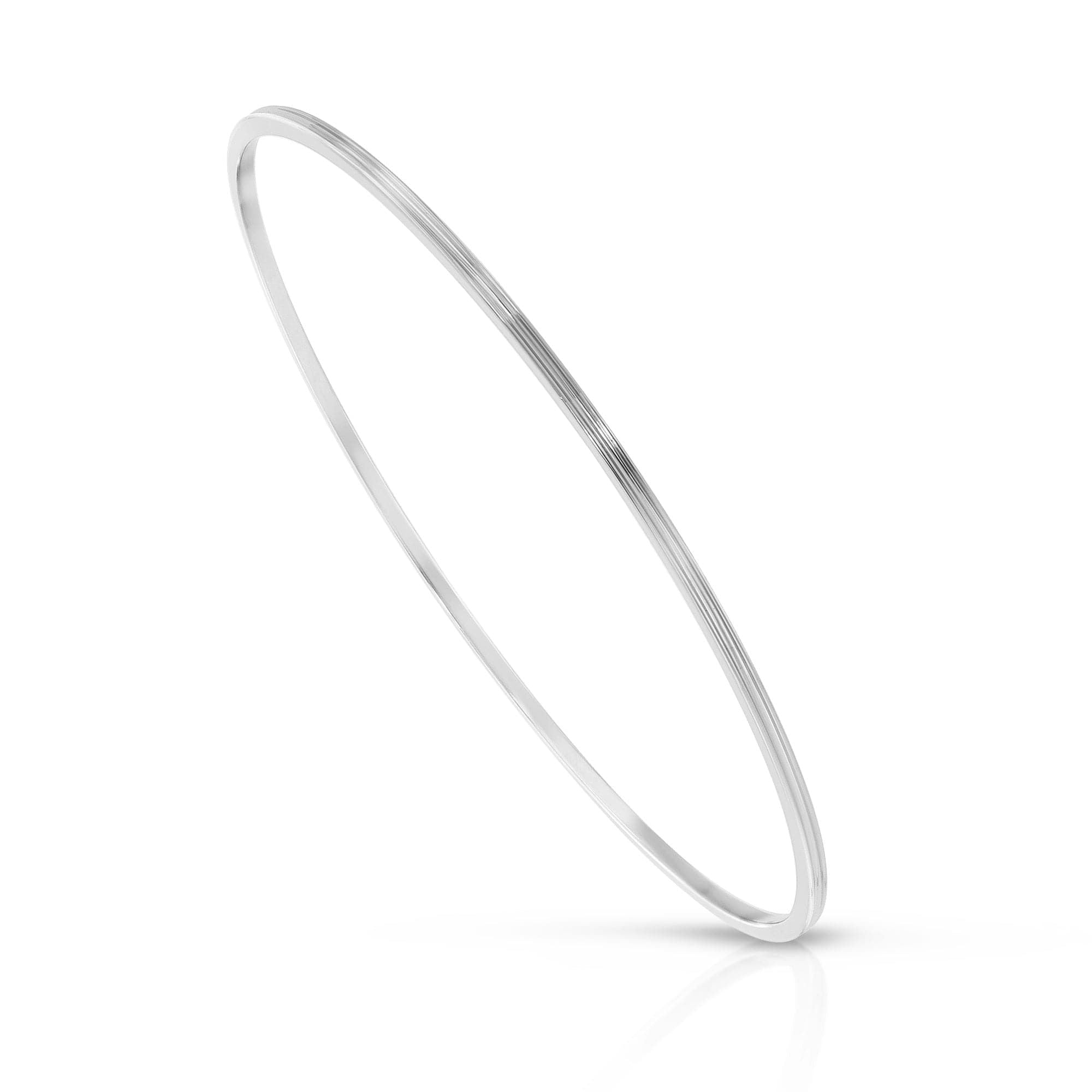 Silver Skinny Lily Bangle made from recycled brass, enhancing eco-friendly fashion