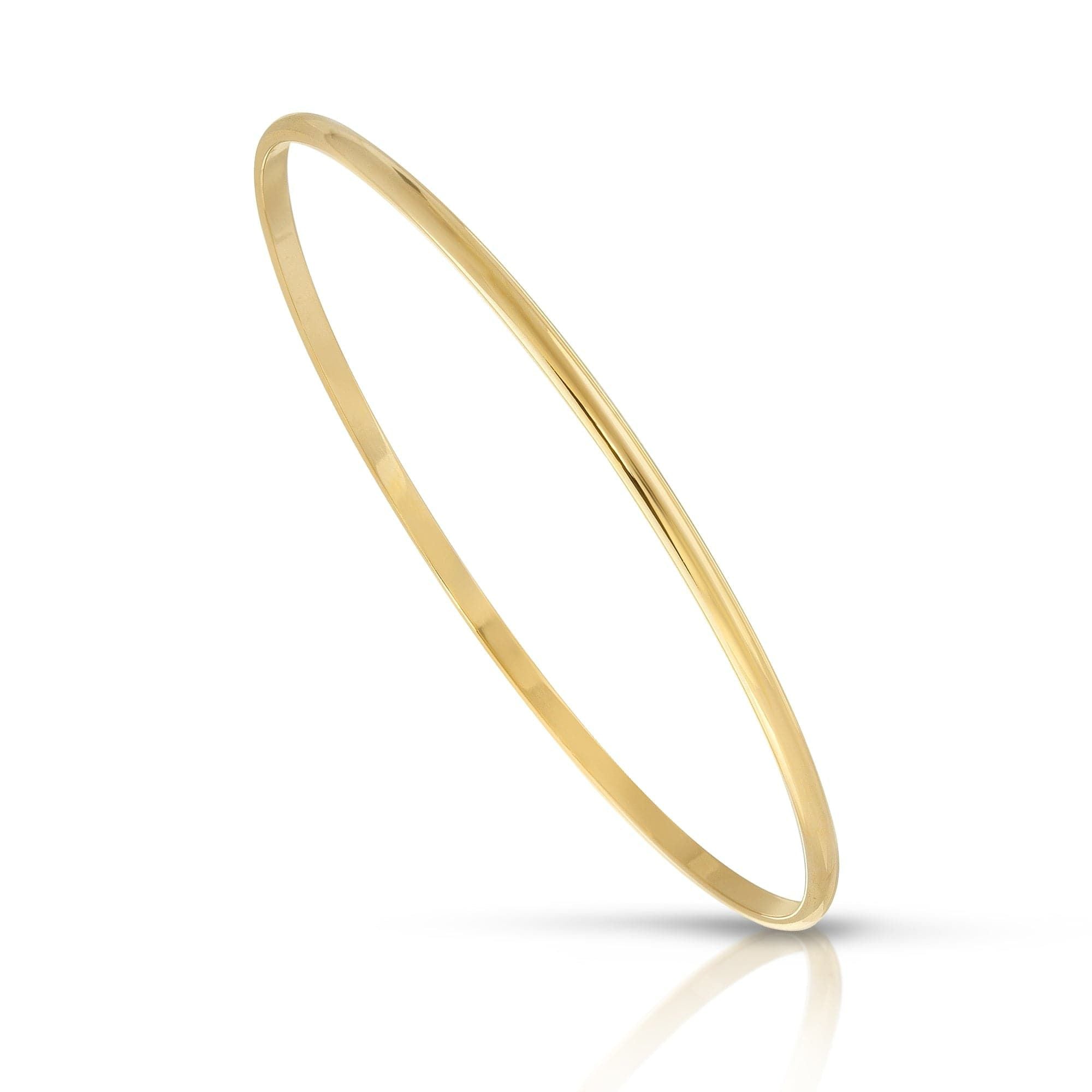 Thin gold Skinny Lucy Bangle made of recycled brass for eco-friendly elegance