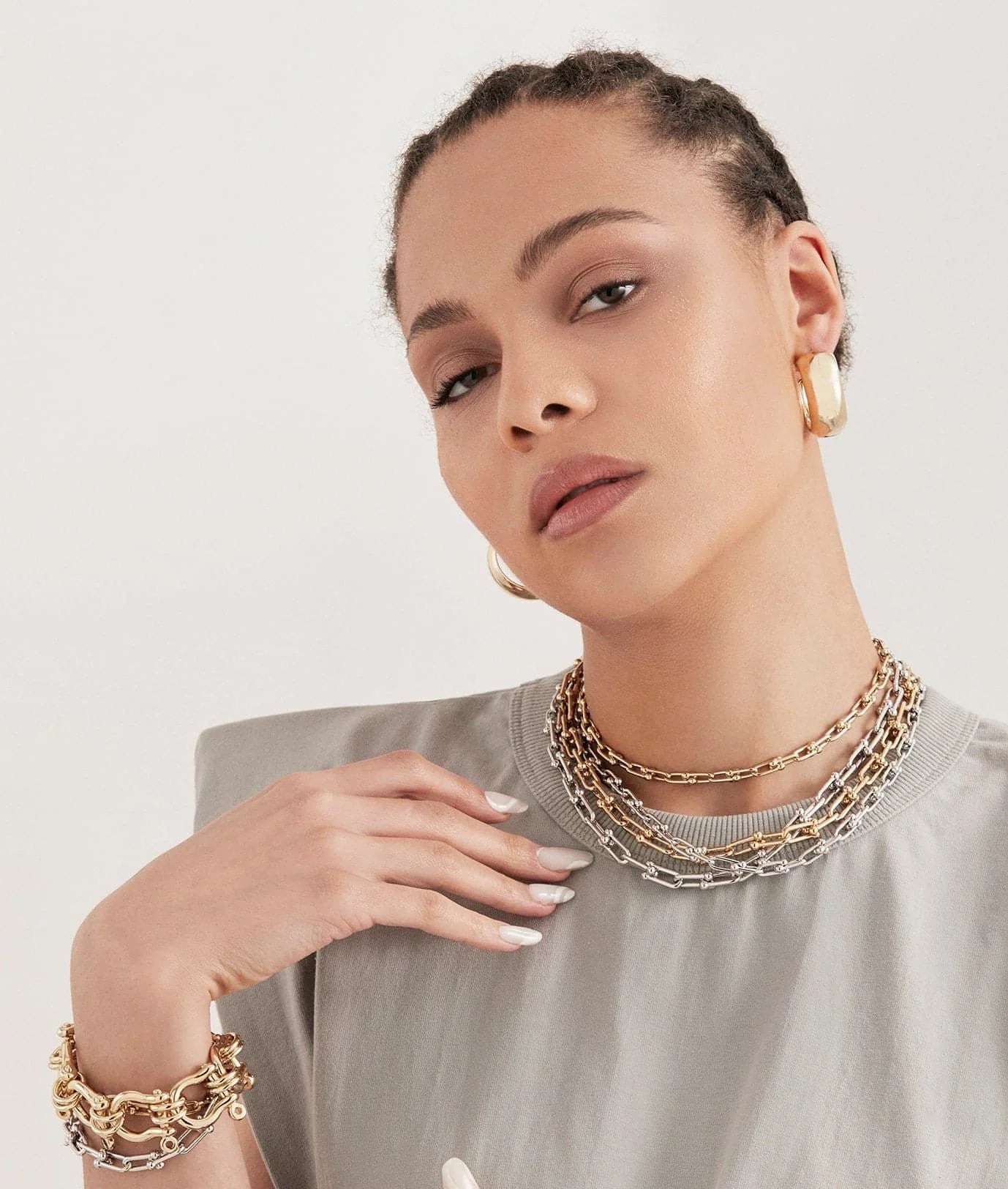 Woman wearing the Small Margaux Necklace with a custom U link in 14k gold jewelry