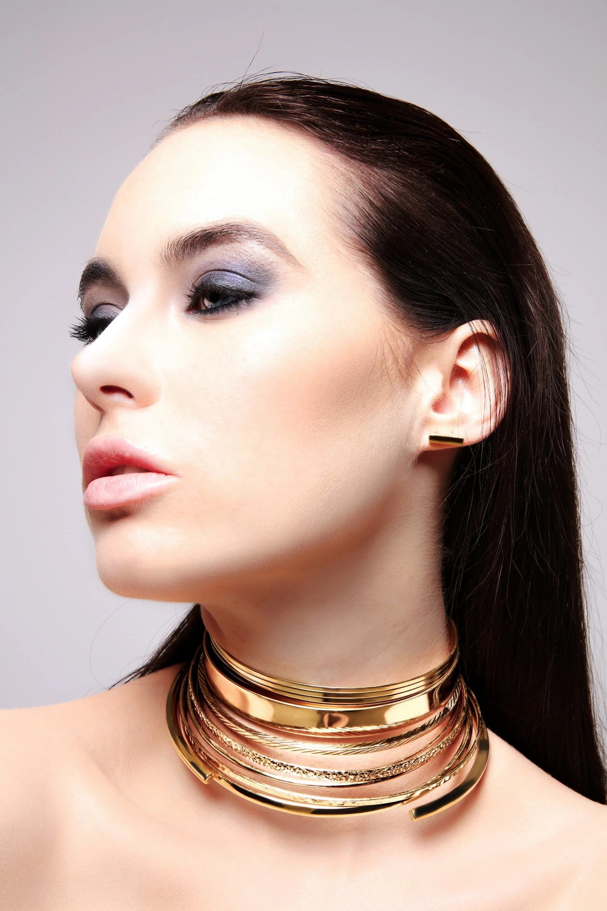 Golden multi-strand choker necklace with 14k yellow gold stick earrings in yellow gold rhodium