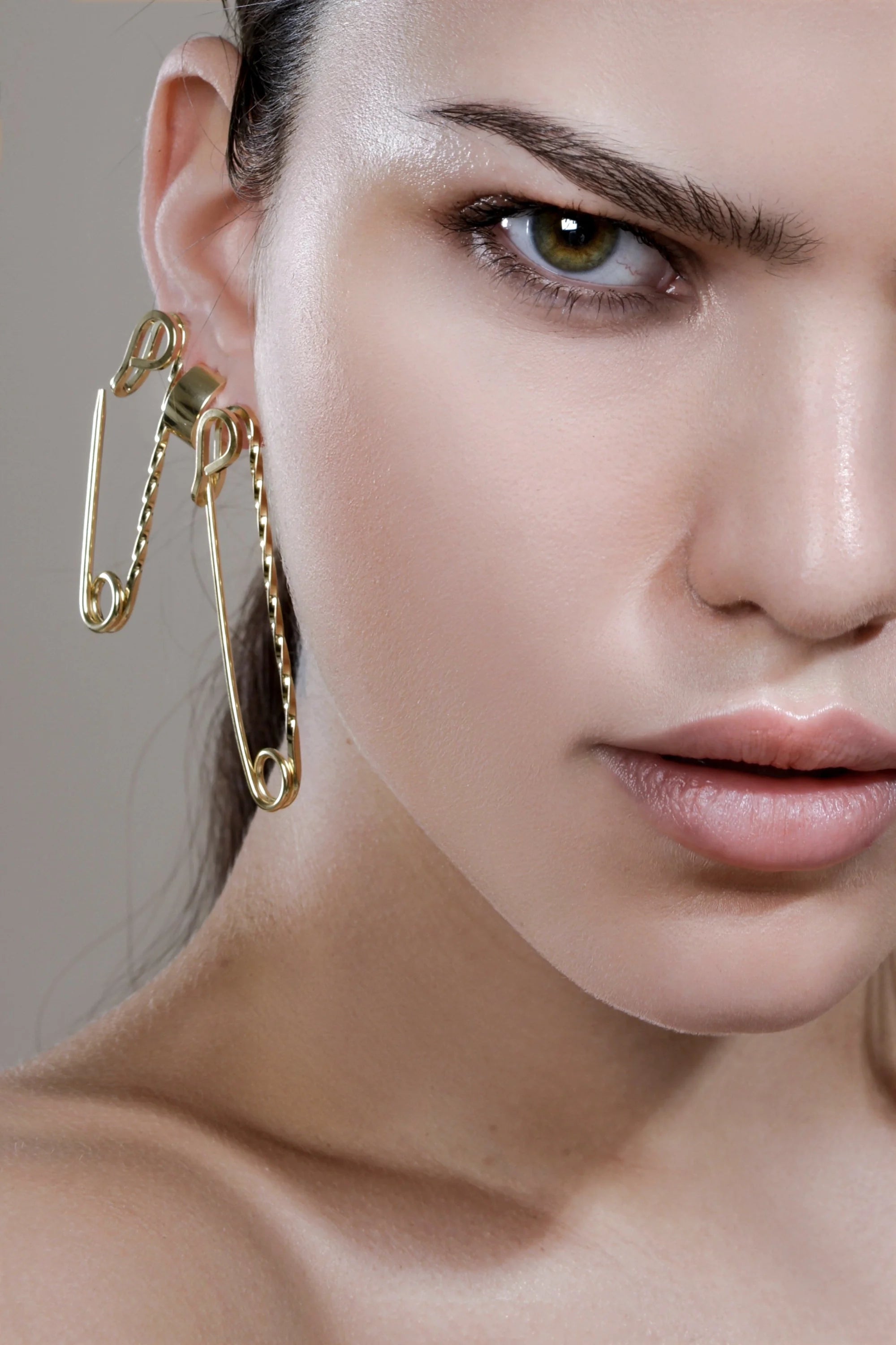 Small twisted safety pin earrings in 14k yellow gold with yellow gold rhodium finish