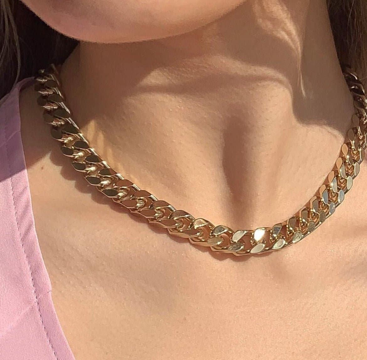 Chunky gold Chain Necklace showcasing the Taraji Necklace with Brass Cuban Link design