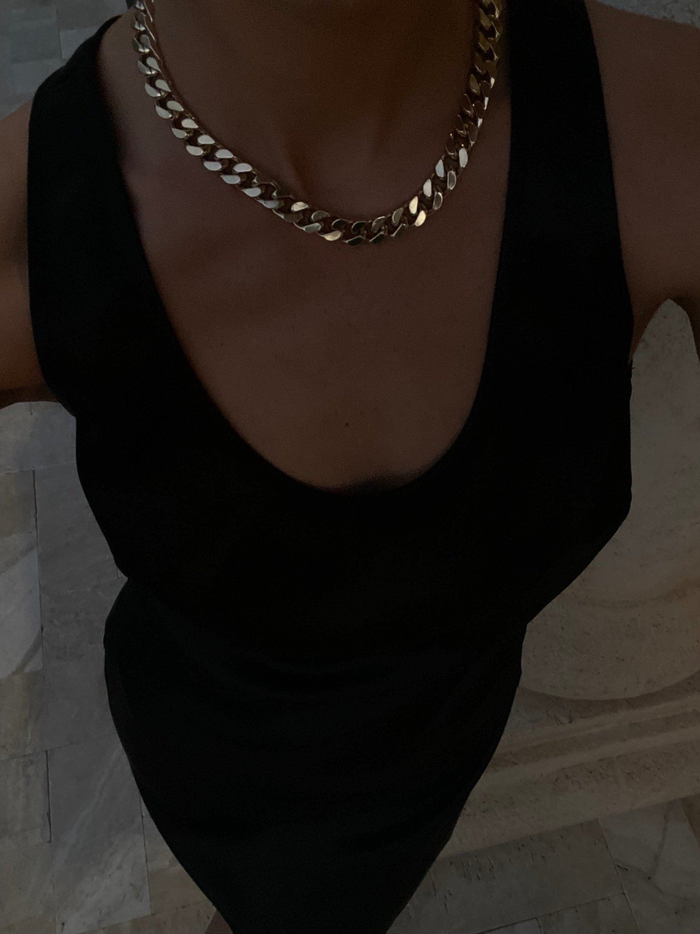 Gold chain necklace of the Taraji Necklace featuring brass Cuban link and rhodium-silver plating