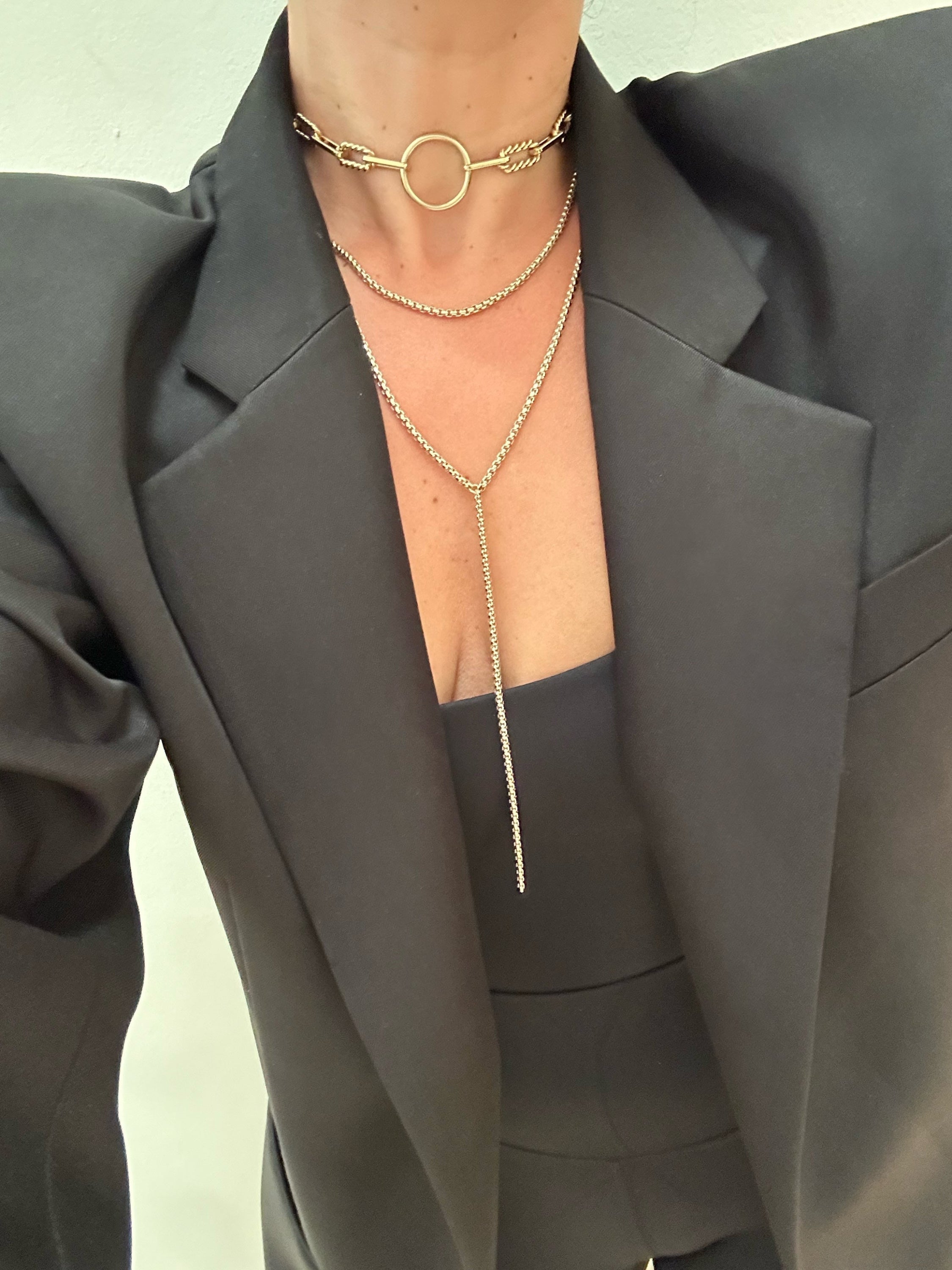 Gold layered necklaces featuring the Thin Luciana Box Chain Necklace in trendy design