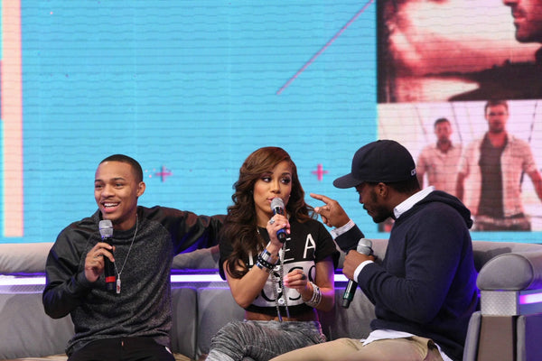 Three people with microphones discussing Keshia Chante’s EKLEXIC Crystal Ladder Necklace.