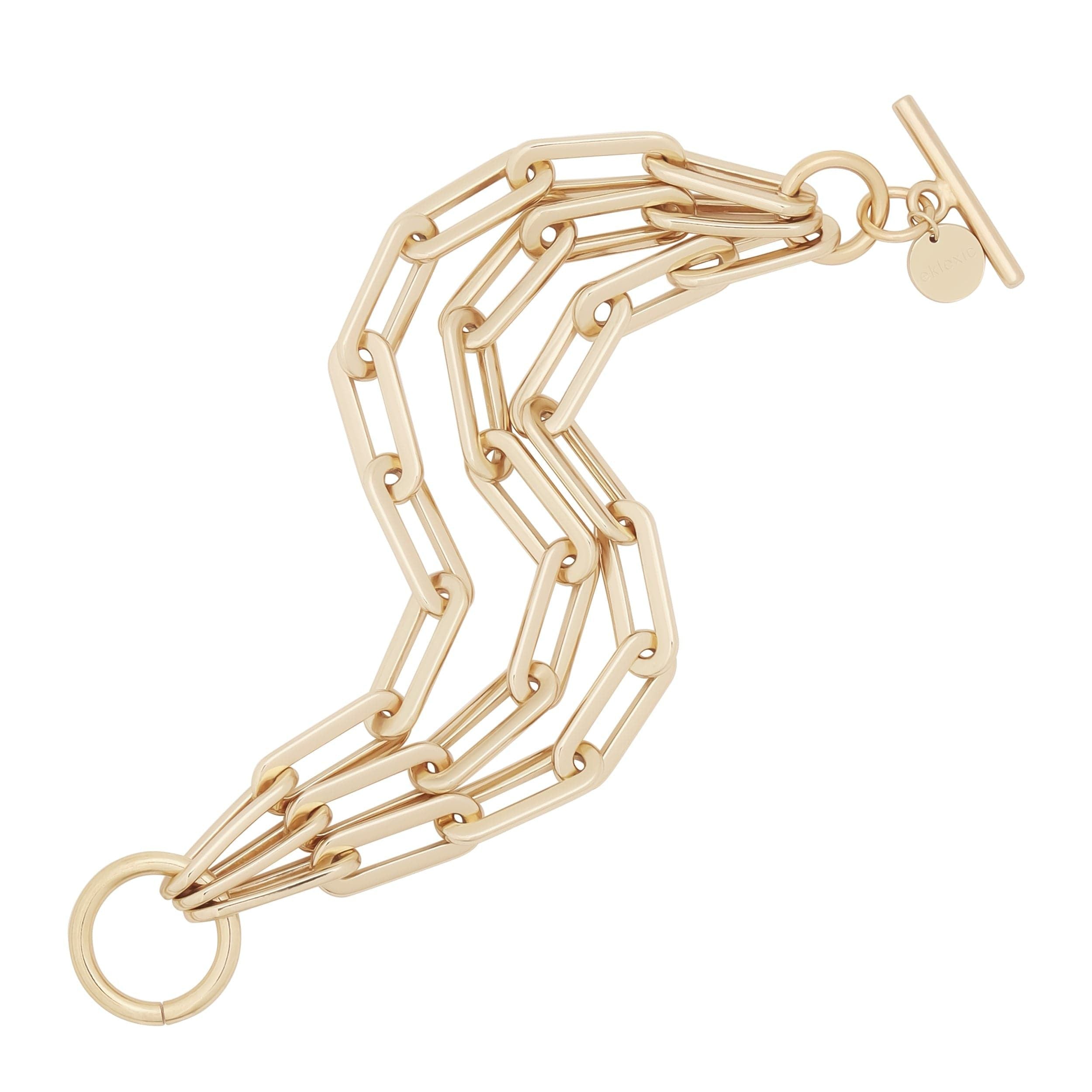 Gold-toned triple-strand chain bracelet, part of the Triple Gisele Toggle collection