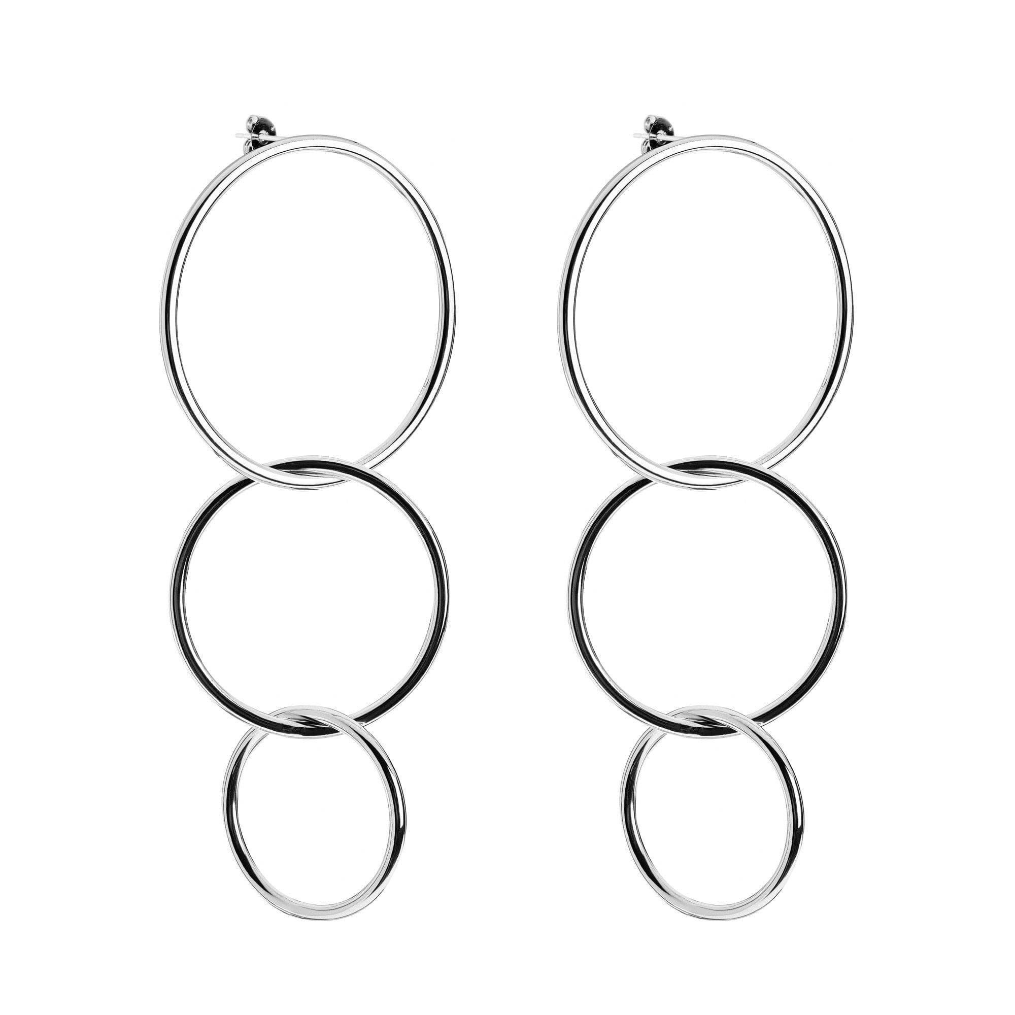 Pair of silver hoop earrings featuring brass circle rings and yellow gold rhodium accents