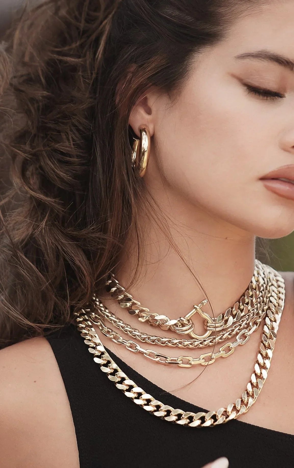 Woman wearing Zolen Hoops gold jewelry looking stylish and trendy